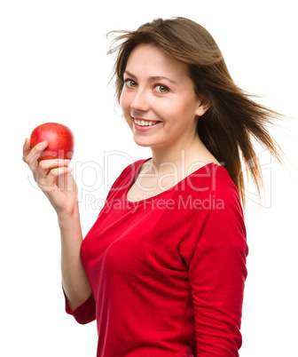 Young happy girl with apple