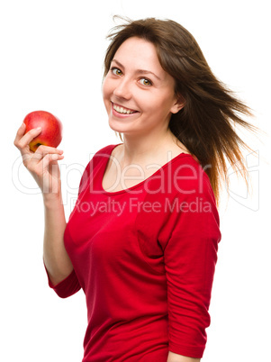 Young happy girl with apple