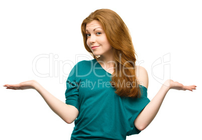 Portrait of a young woman raised her hands up