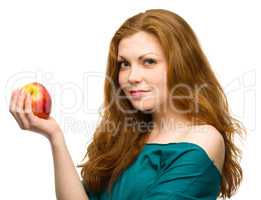 Young happy girl with apple