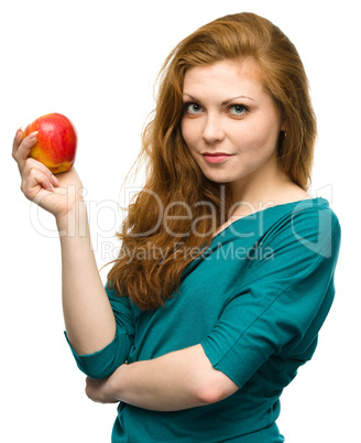 Young happy girl with apple