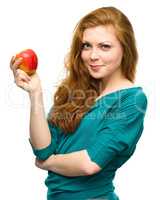 Young happy girl with apple