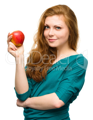 Young happy girl with apple