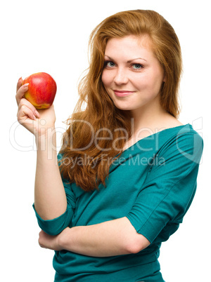 Young happy girl with apple