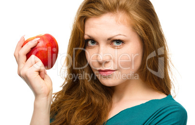 Young happy girl with apple