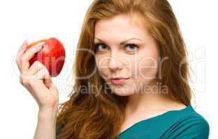 Young happy girl with apple