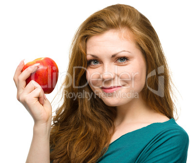 Young happy girl with apple