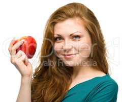 Young happy girl with apple