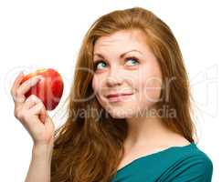 Young happy girl with apple