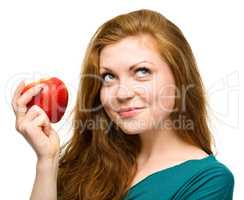 Young happy girl with apple