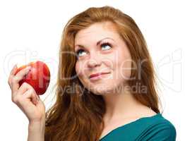Young happy girl with apple