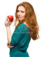 Young happy girl with apple