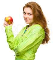 Young happy girl with apple