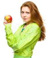 Young happy girl with apple