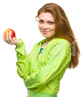 Young happy girl with apple