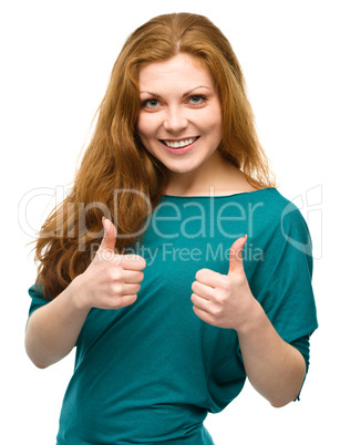 Woman is showing thumb up gesture