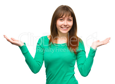 Portrait of a young woman raised her hands up