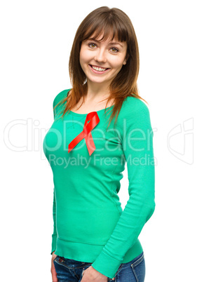 Woman with the red awareness ribbon