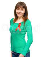 Woman with the red awareness ribbon