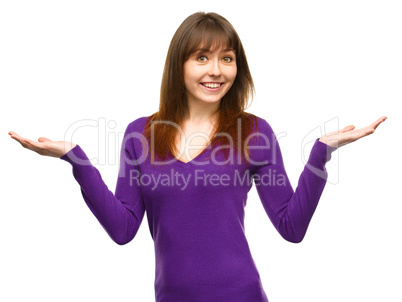 Portrait of a young woman raised her hands up