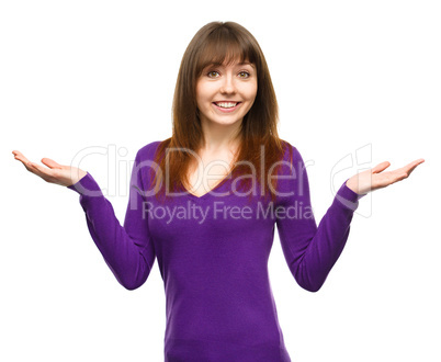 Portrait of a young woman raised her hands up