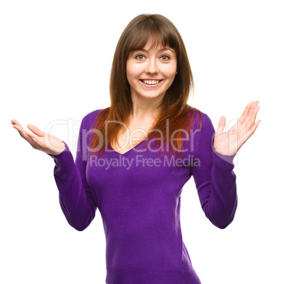 Portrait of a young woman raised her hands up