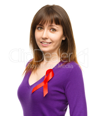 Woman with the red awareness ribbon