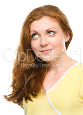 Young happy woman is looking up and smile Young happy woman is looking up and smile