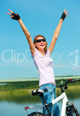 Young woman raised her hands up in joy