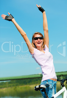 Young woman raised her hands up in joy