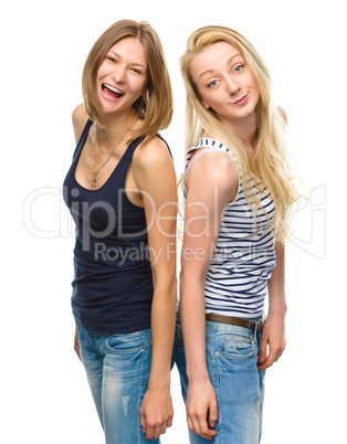 Two young happy women posing