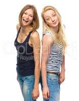 Two young happy women posing