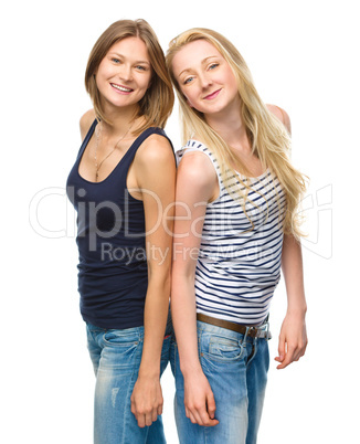 Two young happy women posing