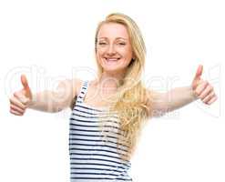 Young woman is showing thumb up gesture