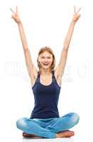 Young woman is raised her hands up in joy