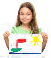 Little girl is showing her painting