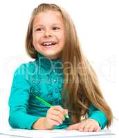 Little girl is drawing using pencils