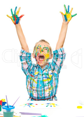 Little girl is rising her hands up in joy