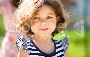 Cute little girl is playing in playground