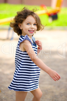 Little girl is playing in playground