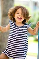 Cute little girl is playing in playground