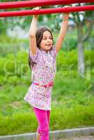 Cute little girl is playing in playground