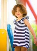 Cute little girl is playing in playground