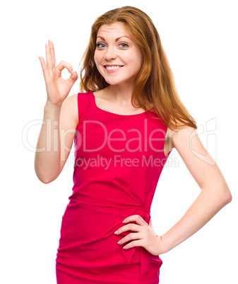 Woman is showing OK sign