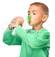 Boy with plastic bottle of water