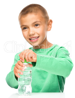 Boy with plastic bottle of water