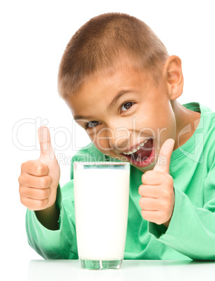 Cute boy with a glass of milk