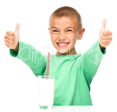 Cute boy with a glass of milk