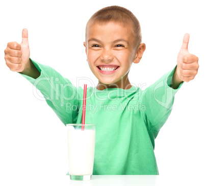 Cute boy with a glass of milk