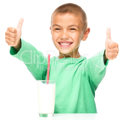 Cute boy with a glass of milk